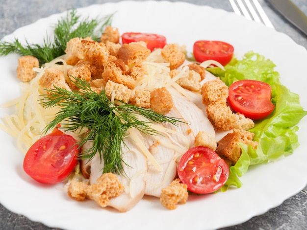 Traditional Caesar salad with chicken fillet. Close up