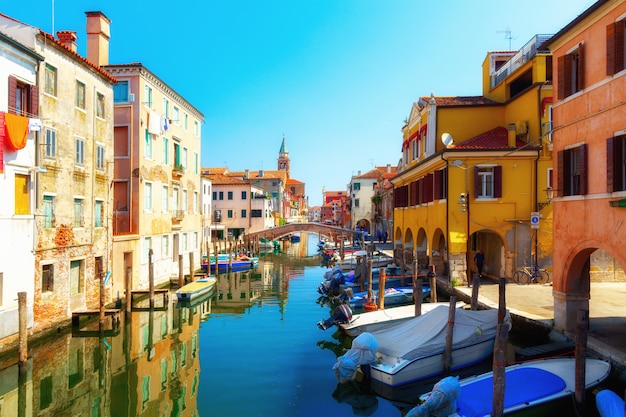 Traditional canal street with gondolas and boats