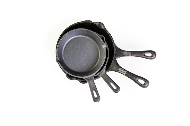 Traditional cast iron skillet on a white background.