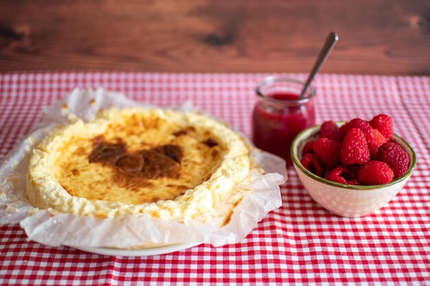 Traditional cheesecake with fresh raspberries