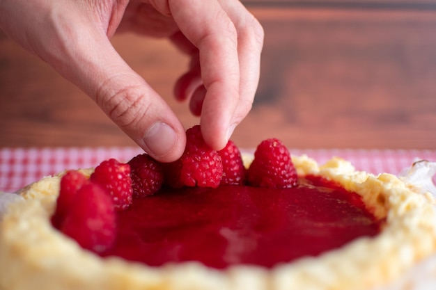 Traditional cheesecake with fresh raspberries