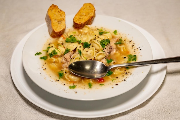 Traditional chicken agnolini capeletti soup Winter soup