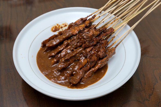 Traditional chicken satay with sweet peanut sauce