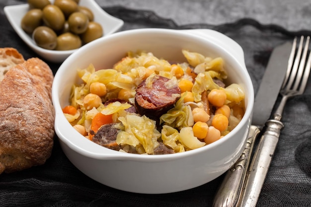 Traditional chickpeas dish in casserole in white bowl