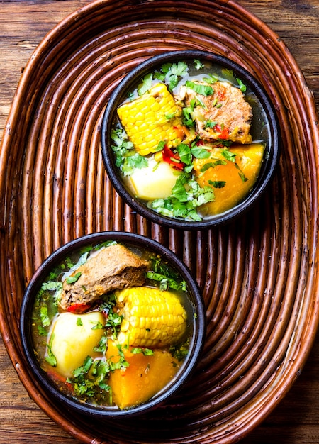 Traditional Chilean pork soup in bowls