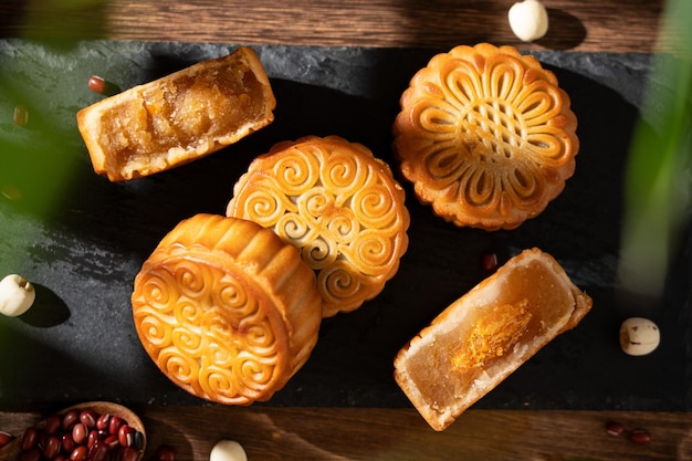 traditional chinese mid autumn festival food mooncake with tea on wooden table