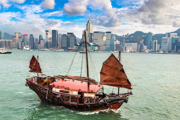 Traditional Chinese wooden sailing ship in Victoria Harbour in Hong Kong