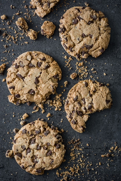 Traditional chocolate chip cookies on black table top view