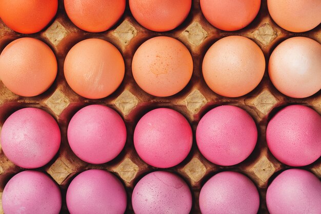 Traditional Christian eastertime, painted eggs in egg box.