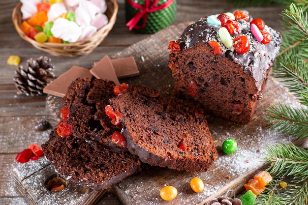 Traditional Christmas cake on wooden table