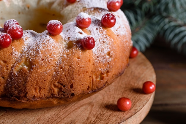 Traditional Christmas cranberry pie. Preparation of the festive table for the celebration of Christmas