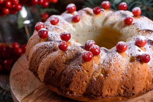 Traditional Christmas cranberry pie. Preparation of the festive table for the celebration of Christmas