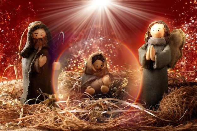 Decorazione natalizia tradizionale presepe sfondo rosso con luci