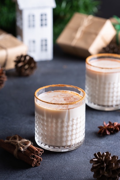 Traditional christmas drink and dessert eggnog with handmade gift boxes