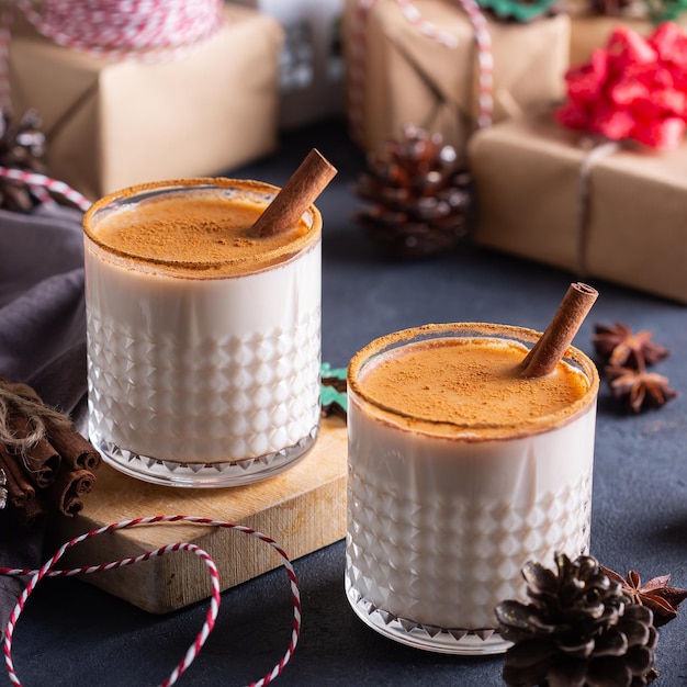 Traditional christmas drink and dessert eggnog with handmade gift boxes