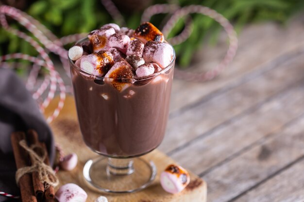 Traditional christmas drink hot cocoa chocolate with roasted marshmallows