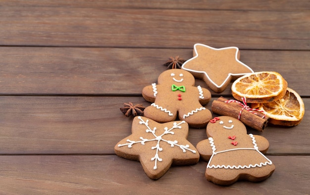 Traditional christmas gingerbread cookies over a wooden table with copy space