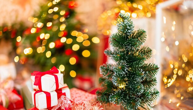 Traditional christmas pine tree with holiday decorations on background and stack of presents