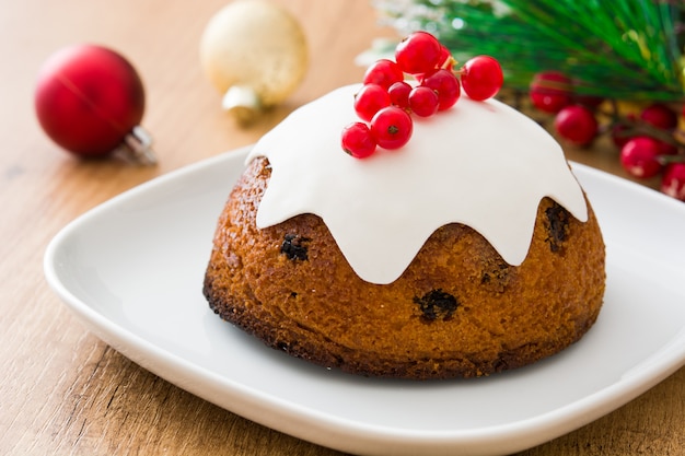 Traditional christmas pudding on wooden table