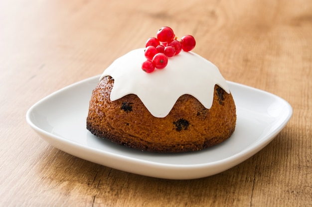 Traditional christmas pudding on wooden table