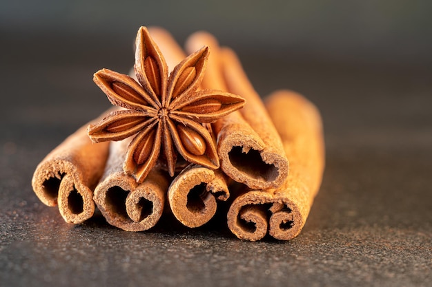 Traditional Christmas spices - Star anise with cinnamon on old table.