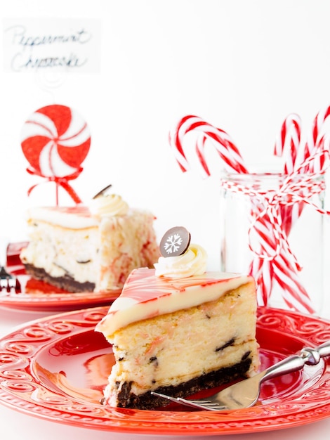 Traditional Christmas White Chocolate Peppermint Cheesecake on white background.