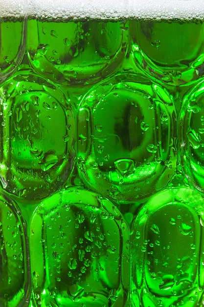 Traditional cold green beer background for Saint Patrick's Day close up