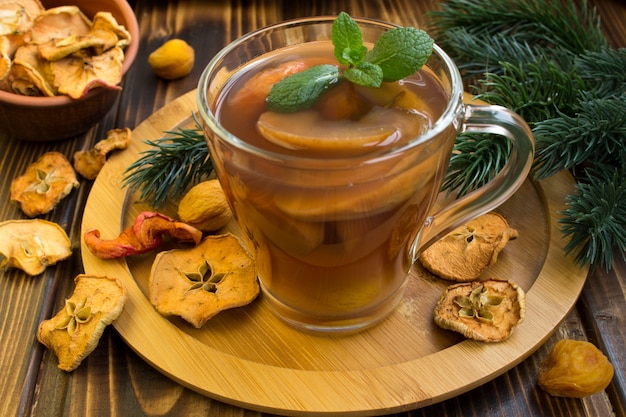 Traditional compote of dried fruits for Christmas on the round cutting board