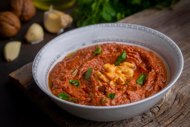 Traditional delicious Turkish appetizer, Muhammara, healthy walnut and roasted red bell pepper dip