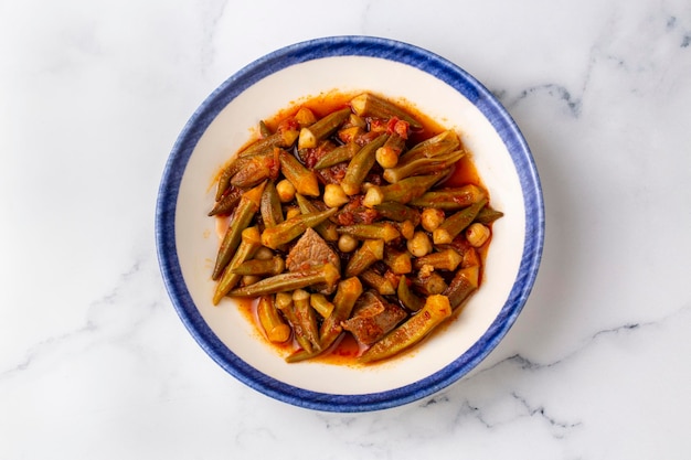 Traditional delicious Turkish cuisine. Locally cooked okra dish. Turkey Adana style meat okra dish. Turkish name; etli bamya yemegi.