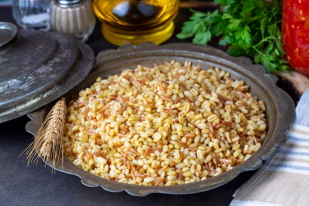 Traditional delicious Turkish food, bulgur pilaf with vermicelli (Turkish name; arpa sehriyeli bulgur pilavi)