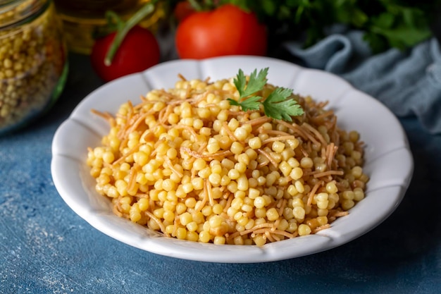 Traditional delicious Turkish food; Couscous pilaf with vermicelli (Turkish name; Sehriyeli kuskus pilavi)