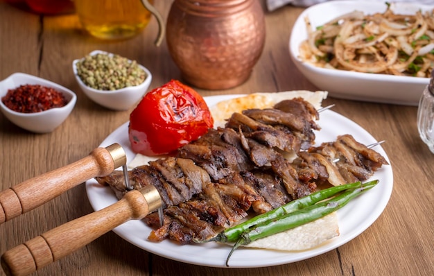 Traditional delicious turkish food oltu cag kebabi doner grilled kebab from erzurum cuisine