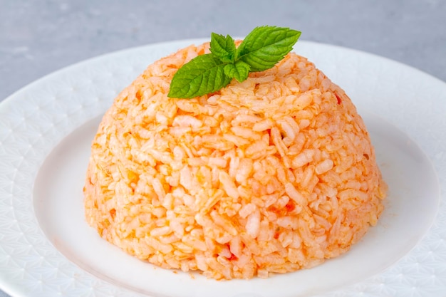 Traditional delicious Turkish food rice pilaf with tomatoes Turkish name Domatesli pirinc pilavi