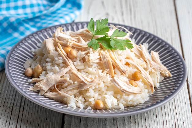 Traditional delicious Turkish food Rice with chickpeas and chicken Turkish name Tavuklu nohutlu pilav or pilaf