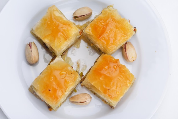 Traditional dessert turkish baklava,well known in middle east and delicious isolated on white background