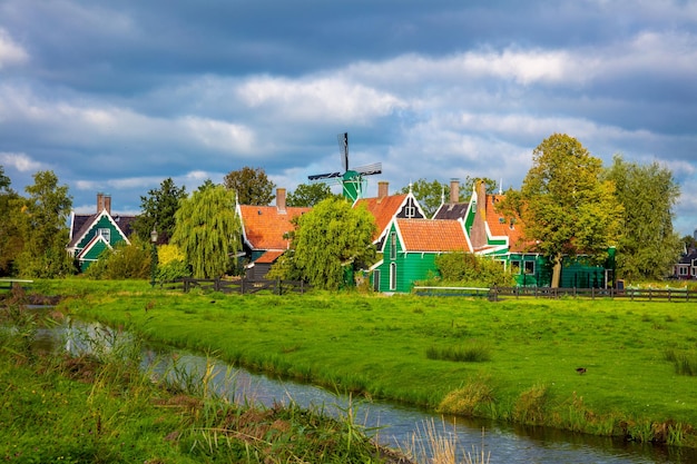 Traditional Dutch village Zaanse Schans near Amsterdam Typical Dutch green houses and windmills Holland Netherlands