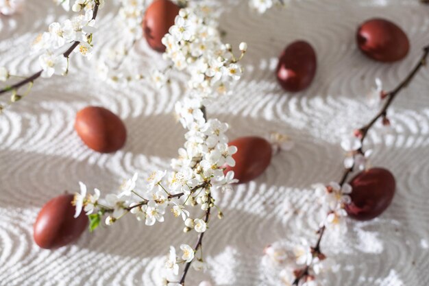 Traditional Easter cakes and colored eggs. A branch tree