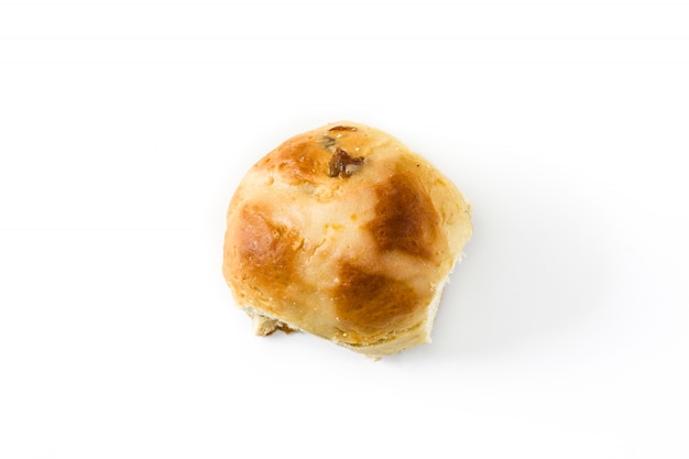 Traditional Easter hot cross bun on white