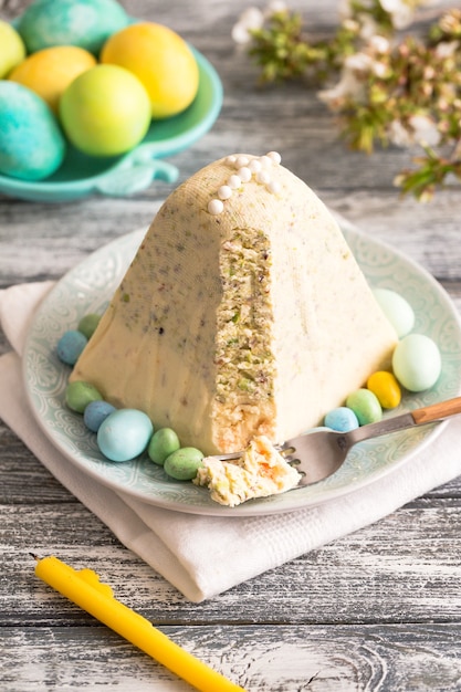 Traditional Easter Ortodox curd cake with pistachios. Traditional Easter cottage cheese dessert. Easter background.