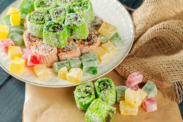 Traditional eastern desserts on wooden surface