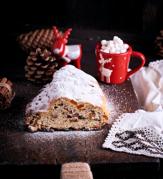 Traditional European cake Stollen with nuts and candied fruit