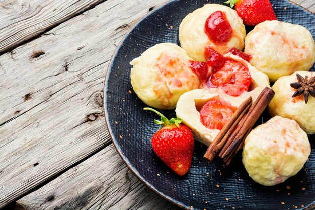 Traditional european dumplings with berries.Dumplings with strawberries or knedlik.Cottage cheese dumplings with strawberry