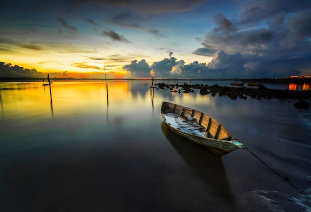 traditional fishing boat in the fishing village at a beautiful sunset