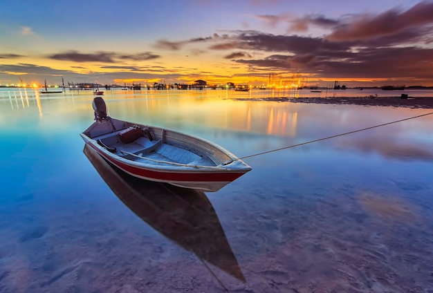 Traditional fishing boat in a fishing village at sunset on Batam island