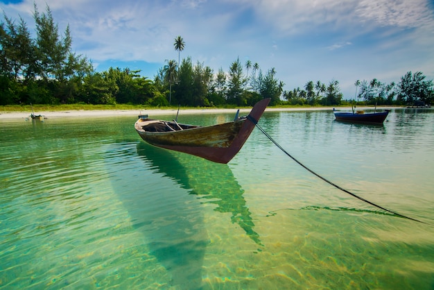 traditional fishing boat at sea with clear water