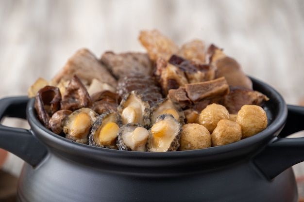 Traditional food of Chinese lunar new year, Buddha jumps over the wall, Chinese Soup Casserole dish, Buddha's Temptation, named Fo Tiao Qiang, close up.