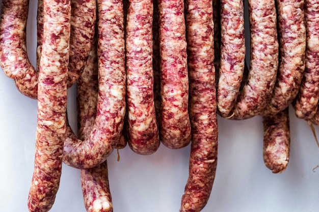 Traditional food Homemade drycured sausage in a butcher's shop Pork and beef sausages