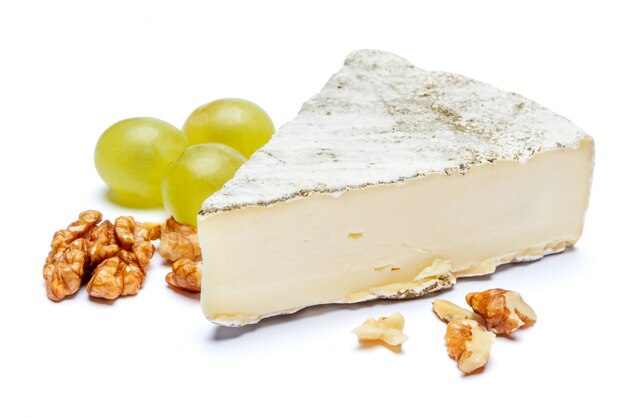 Traditional french brie cheese on a white table