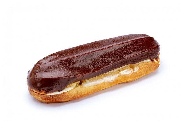 Traditional french dessert. Isolated eclair with custard and chocolate icing on white background